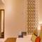 Отель Lazylagoon Sarovar Portico Suites