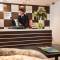 Отель Escala Hotel Suites