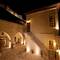 Отель Kayakapi Premium Caves Cappadocia