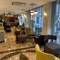 Отель Regency World Hotel Suites