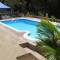Отель Albizia Lodge Green Estate 