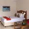 Отель Manna Beach Villa 