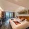 Отель Shengyi Holiday Villa Hotel & Suites