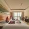Отель Shengyi Holiday Villa Hotel & Suites