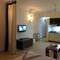 Отель Comfy Home Apartment