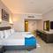 Отель Invidia Coral Beach Tiran