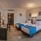 Отель Invidia Coral Beach Tiran