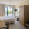 Отель Vrachia Beach Hotel & Suites