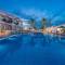 Отель Dionysos Hotel & Suites