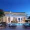 Отель The Royal Blue a Luxury Beach Resort