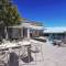 Отель The Royal Blue a Luxury Beach Resort