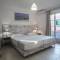Отель EVINA ROOMS & SUITES