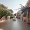 Отель EVINA ROOMS & SUITES