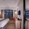 Отель Hotel NEO+ Kuta Legian