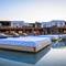 Отель Myconian Crown Suites
