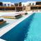 Отель Myconian Crown Suites
