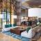 Отель Al Jaddaf Rotana Suite Hotel