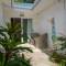 Отель Le Nautique Luxury Beachfront Apartments
