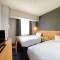 Отель SureStay Plus Hotel by Best Western Shin-Osaka