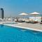 Отель Four Points by Sheraton Production City, Dubai