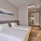 Отель Sleeping Lion Suites