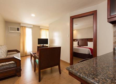 Отель MJ Hotel and Suites