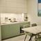 Отель Stylo Residences & Suites