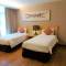Отель Cormar Suites