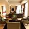 Отель Cormar Suites
