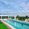Отель Ducassi Rooftop Pool Suites Beach Club and Spa