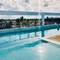 Отель Ducassi Rooftop Pool Suites Beach Club and Spa